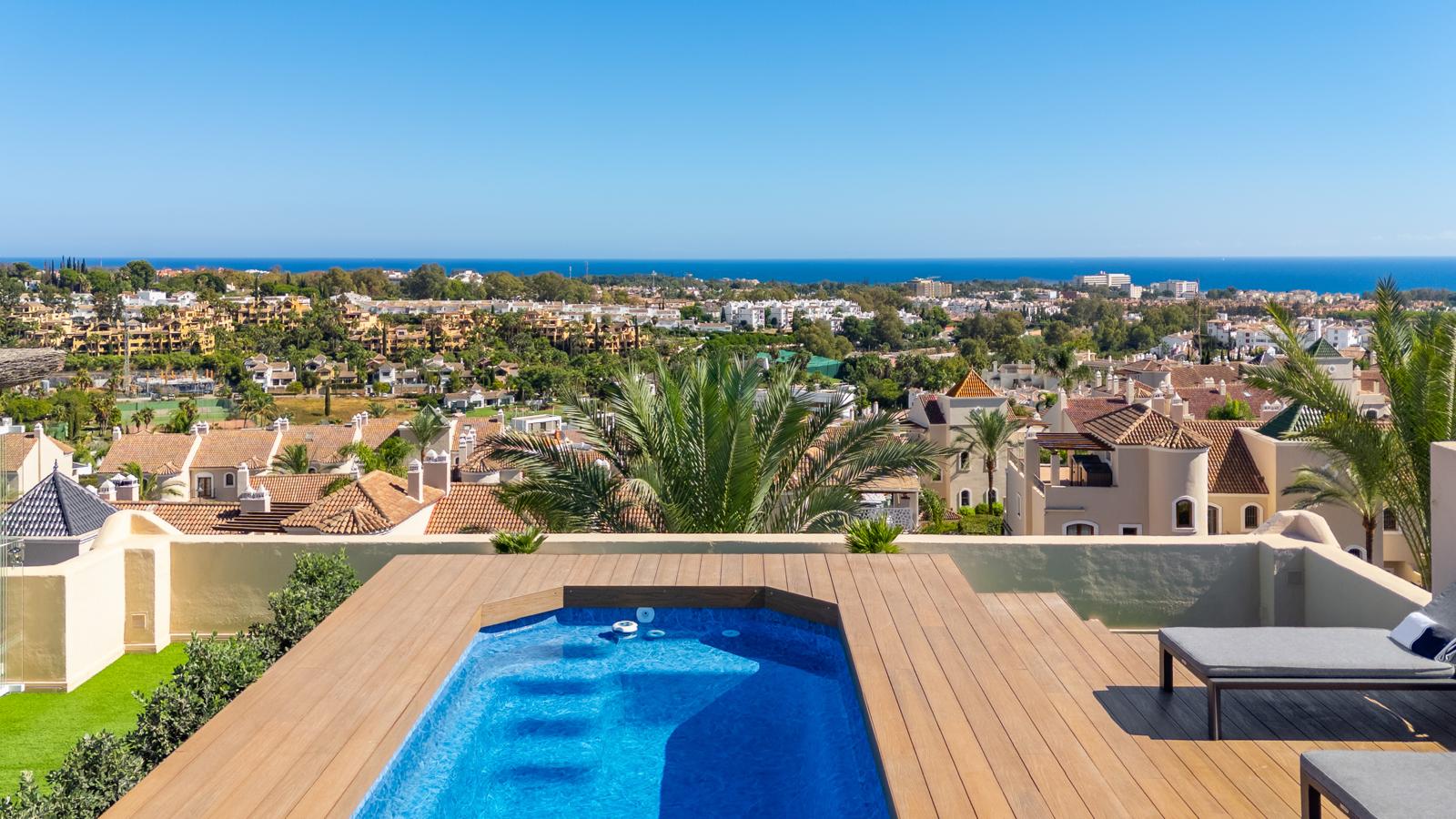 Wide panoramic view from the rooftop pool over Marbella and the sea